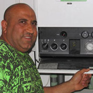 Ismael holding a gas boiler panel